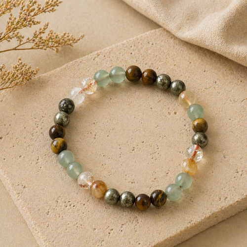 Multicolor beaded stretch bracelet with natural and metallic beads on beige background